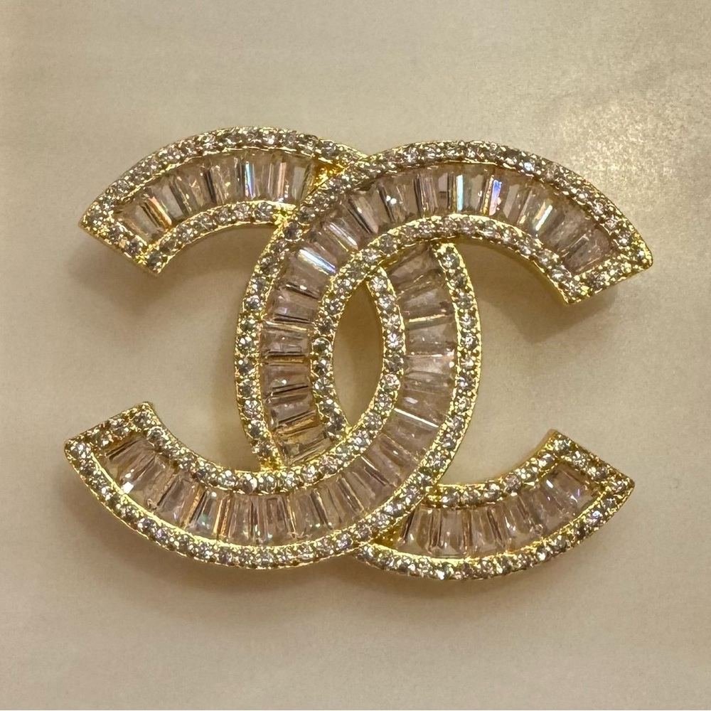 Chanel pin and brooches